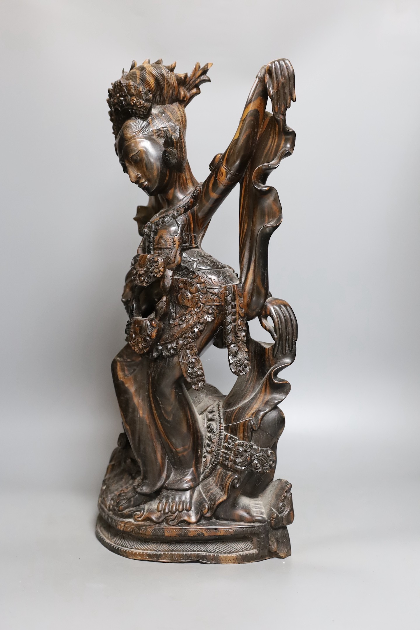 A Balinese carved coromandel deity group , 50 cms high.